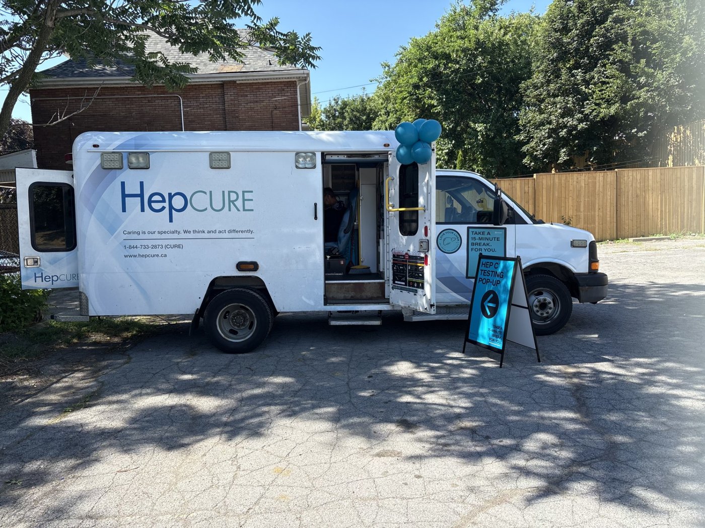 Take 15 campaign — HepCURE mobile unit with on-site A-frame signage